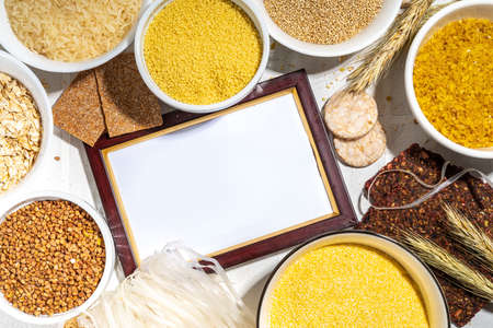 Selection of whole grains gluten free cereals. Set of various non-gluten cereals: rice, buckwheat, corn groats, quinoa, millet, oats, buckwheat, bulgur, porridge, barley, white background copy spaceの写真素材