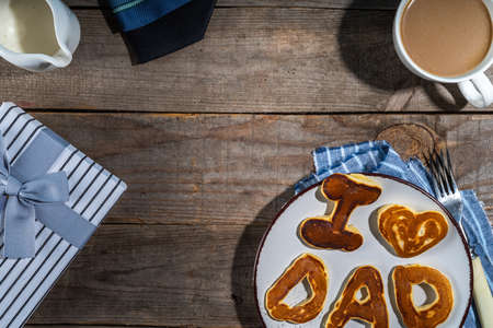 Father day pancakes. Homemade kids cooked father day pancakes with lettering I love dad, on plate,...