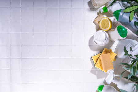 Eco friendly organic cleaning concept. Eco-friendly cleaner utensils - eco brushes, tools sponges, natural cleaning products, soda, soap, lemon, vinegar, bottles with green leaves on white backgroundの写真素材