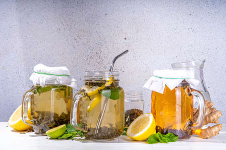 Homemade cold brew tea. Set of various healthy summer drinks, cold slow brewed tea in mason jar,...