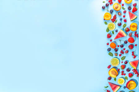 Summer vitamin food concept, various fruit and berries watermelon peach mint plum apricots blueberry...