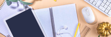 Simple pastel autumn office work, education flatlay top view copy space. Tablet with empty screen...