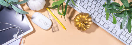 Simple pastel autumn office work, education flatlay top view copy space. Tablet with empty screen...