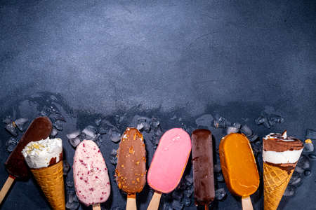 Set of various ice creams on black background. Assortment of ice creams    on dark background top view flat lay copy spaceの写真素材