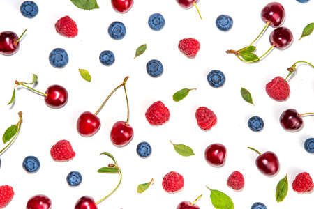Mix of isolate blueberry, blackberry, raspberry, cherry and mint. Fresh ripe berry set isolated on white backgroundの写真素材