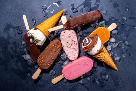 Set of various ice creams on black background.