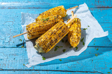 Sweet corn grilled with butter, cheese, cilantro and herbs. Vegetarian, healthy, clean eating...