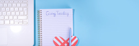 Giving Tuesday background, global day of charitable action, giving, donations. after Black Friday shopping day. Charity, give help, donations support day with coins jar, red heart, laptop, gift boxの写真素材