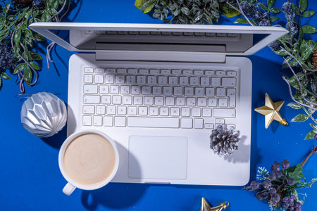Christmas sale, preparation for holidays concept. winter office workplace background. Laptop, hot...