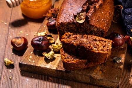 Homemade chestnut cake, sweet vegan chocolate chestnut brownie bread with honey and caramel sauce