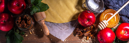 Apple pie cooking background. Autumn pie, cookie, cake baking background with apples, spices, honey and raw dough, ingredients for making sweet fall pastry, on wooden background copy spaceの写真素材