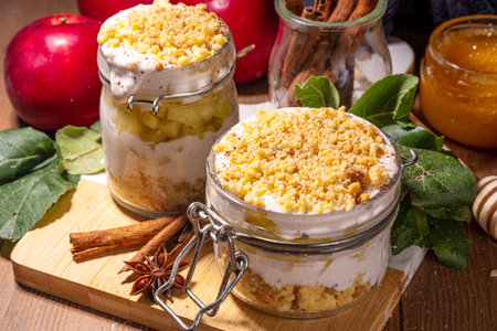 Apple pie in jar, apple layered breakfast parfait dessert, with tart crumble and spices, No Bake cheesecake in a portioned jarsの写真素材