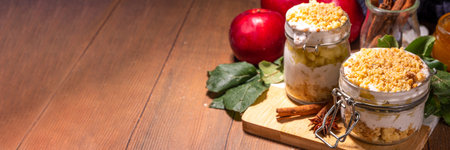 Apple pie in jar, apple layered breakfast parfait dessert, with tart crumble and spices, No Bake cheesecake in a portioned jarsの写真素材