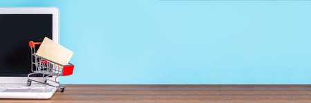 Doing online shopping, online payment with credit card simple background, white laptop with...