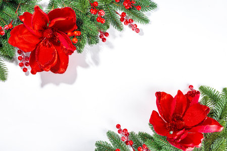 White simple christmas, New Year holidays background with Christmas tree branches, winter red berries, poinsettia flowers, flatlay top view copy spaceの写真素材