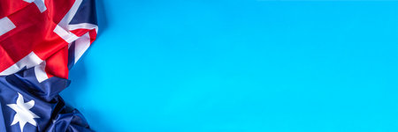 Australia Day greeting card Background with australian flag, silver stars, with text Happy Australia day, paper red, blue, white decor, over blue background copy spaceの写真素材