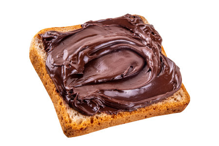 Bread with chocolate hazelnuts paste cream isolated on white background. Sandwiches with chocolate nut toppingの写真素材