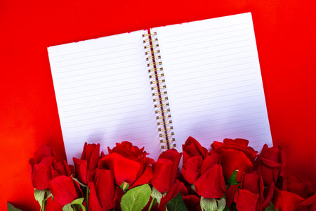 Red roses over red background flat lay. Valentine's Day, Birthday, March 8 Women's Day, Mother Day...