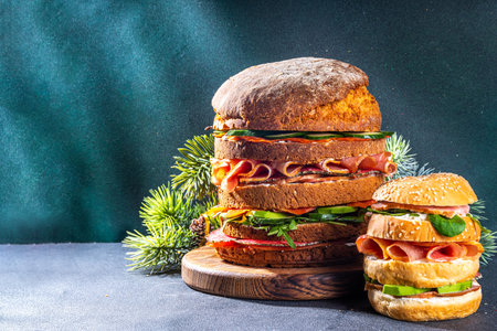 Christmas panettone gastronomico. Pan Brioche salato Panettone gastronomico Italian Christmas, New Year antipasto appetizer sandwiches, with sausage, meat, cheese, olives, salmon fishの写真素材