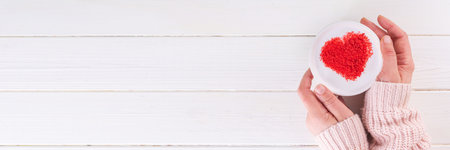 Coffee cup for Valentine day greetings. Cup of cappuccino latte with whipped milk foam and coffee...