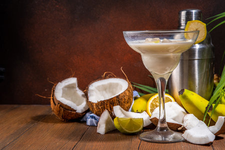 Banana coconut cocktail, fruit tropical mocktail with whipped creamy fruit