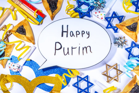 Jewish holiday Purim greeting card background, jewish spring start holiday carnival flat lay with traditional carnival masks, rattle, gifts and hamantaschen cookie on white backgroundの写真素材