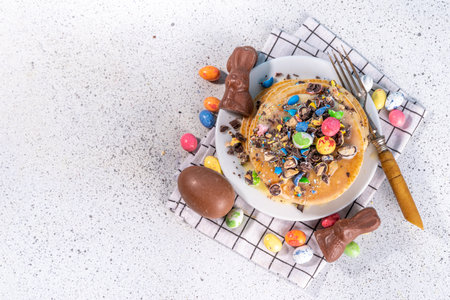 Children's funny cute breakfast for Easter. American pancakes, fried batter cakes with Easter...