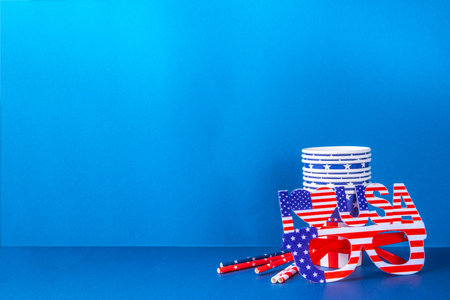 Happy Labor Day, Presidents Day, Fourth of July Independent Day, Memorial day, Columbus day background. Blue background with USA flag color paper fans and decorations, party accessoriesの写真素材