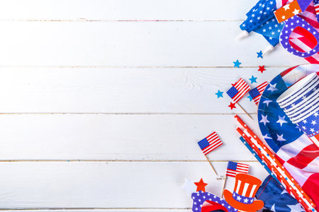 Happy Labor Day, Presidents Day, Fourth of July Independent Day, Memorial day, Columbus day background. White wooden background with USA flag color paper fans and decorations, party accessoriesの写真素材
