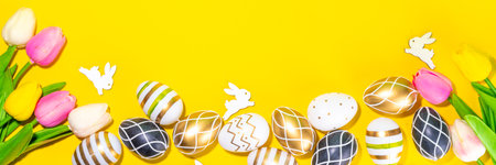 Bright Easter greeting card background. Trendy colored black, golden, stripe painted Easter eggs...