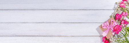 Simple spring holiday greeting card background with bouquet of beautiful ranunculus flowers. Gift for holiday, birthday, Wedding, Mother's Day, Valentine's day, Women's Day. Floral arrangement flatlayの写真素材