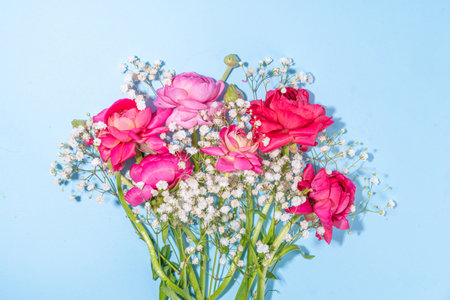 Simple spring holiday greeting card background with bouquet of beautiful ranunculus flowers. Gift...