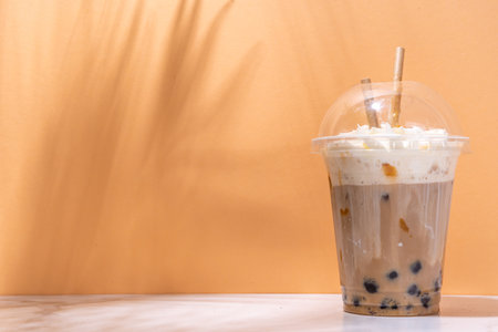 Tapioca boba balls coffee frappe, asian trendy cold coffee drink with tapioca balls and whipped...