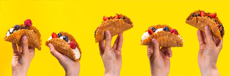 Various sweet taco ice creams. Waffle taco shells with chocolate and vanilla flavour ice cream with different fruits, berry, toppingsの写真素材