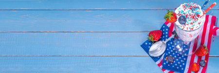 Patriotic USA American loaded milkshake, sweet dessert with red, white, blue sugar sprinkles for Independence Day july 4 partyの写真素材