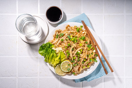 Asian shimeji noodles dish. Chow Mein noodles pasta, with stir fried vegetables, soy sauce and shimeji mushroomsの写真素材
