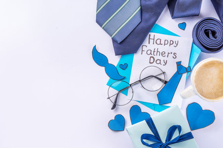 Accessory and decor arranged Father's Day greeting card, Dad`s holiday flat lay, table setting with...