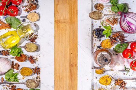 Spices for cooking on white background. Different seasonings, spices and herbs paprika, pepper, turmeric, salt, basil, mint, cinnamon, garlic and other aromatic ingredients for preparation foodの写真素材