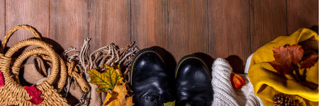 Preparation for fall and winter season, autumn cozy clothes and decor background, wooden table top view copy spaceの写真素材