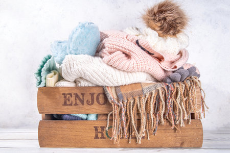 Preparation for fall and winter season, autumn warm cozy clothes, Stack of clean freshly laundered,...