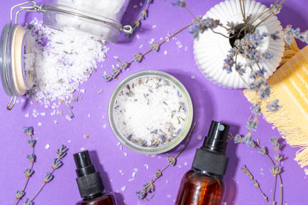 Cosmetics with lavender oil and dry lavender flowers. Aromatic essential oil, lavandula salt, spray, beauty care, wellness and natural beauty conceptの写真素材