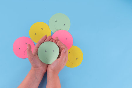 Positive thinking, mental health, ability to live without stress concept. world mental health day background. Multicolored paper emoticons with different moodsの写真素材