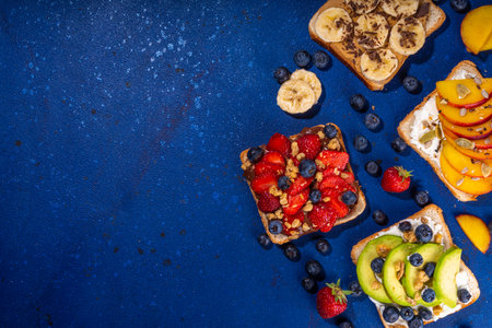 Fruit berry sandwiches. Various toasts with peanut butter, cream cheese, chocolate spread with...