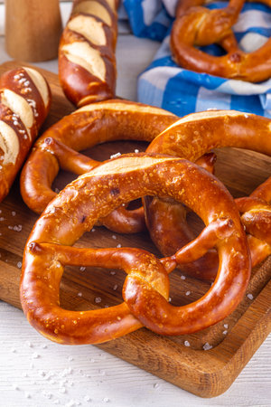 Homemade bavarian pretzels on kitchen table, traditional Oktoberfest, bavarian, German  breakfast lye bun pastryの写真素材
