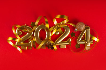 Happy new year 2024 greeting card background with gold numbers, champagne bottle, serpentine,...