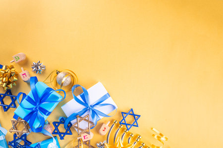 Happy Hanukkah greeting card background. Jewish New Year holiday flat lay with traditional symbols of hanukkah festival, menorah, donuts and decorations copy spaceの写真素材