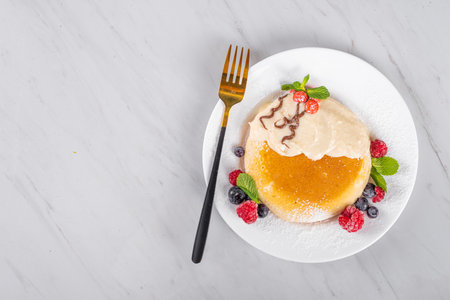 Funny Christmas breakfast pancake in form of Christmas symbols - Christmas pudding, gingerbread man, Santa Claus' reindeer, with chocolate spread, berries, candy decor. Children holiday snack, brunch.の写真素材