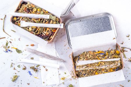 Alternative healthy berbal smoking blend. Handmade craft cigarette, preparation process, with...