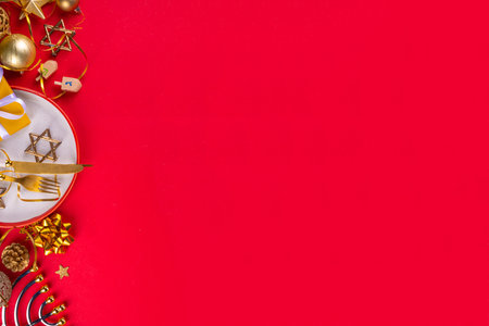 Jewish holiday Hannukah table setting greeting card background, festive dinner brunch invitation or menu. Flat lay with plate, cutlery set, with Hannukah decorations, top view copy spaceの写真素材