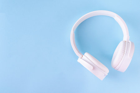 Sound Therapy Mental Health and Wellness concept. Light blue background with laptop and headphones top view flat lay copy spaceの写真素材